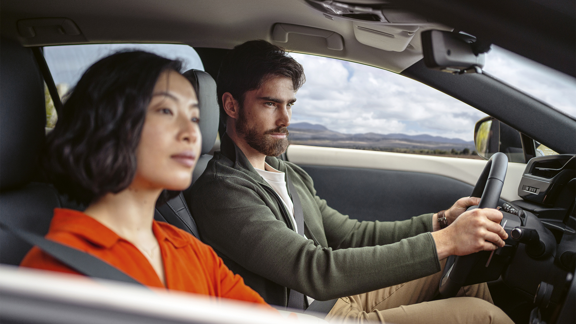 2023-lexus-rz-450e-under-couple-driving-back-catalogue-1